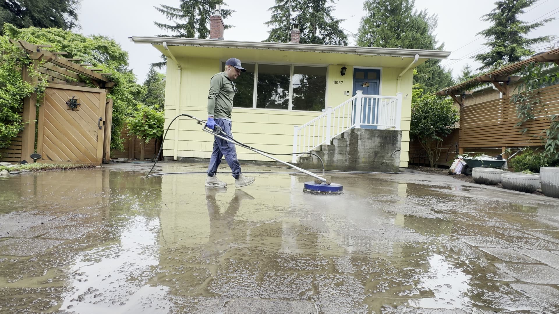 Seattle Suds surface cleaning a driveway, grime lifting in one pass