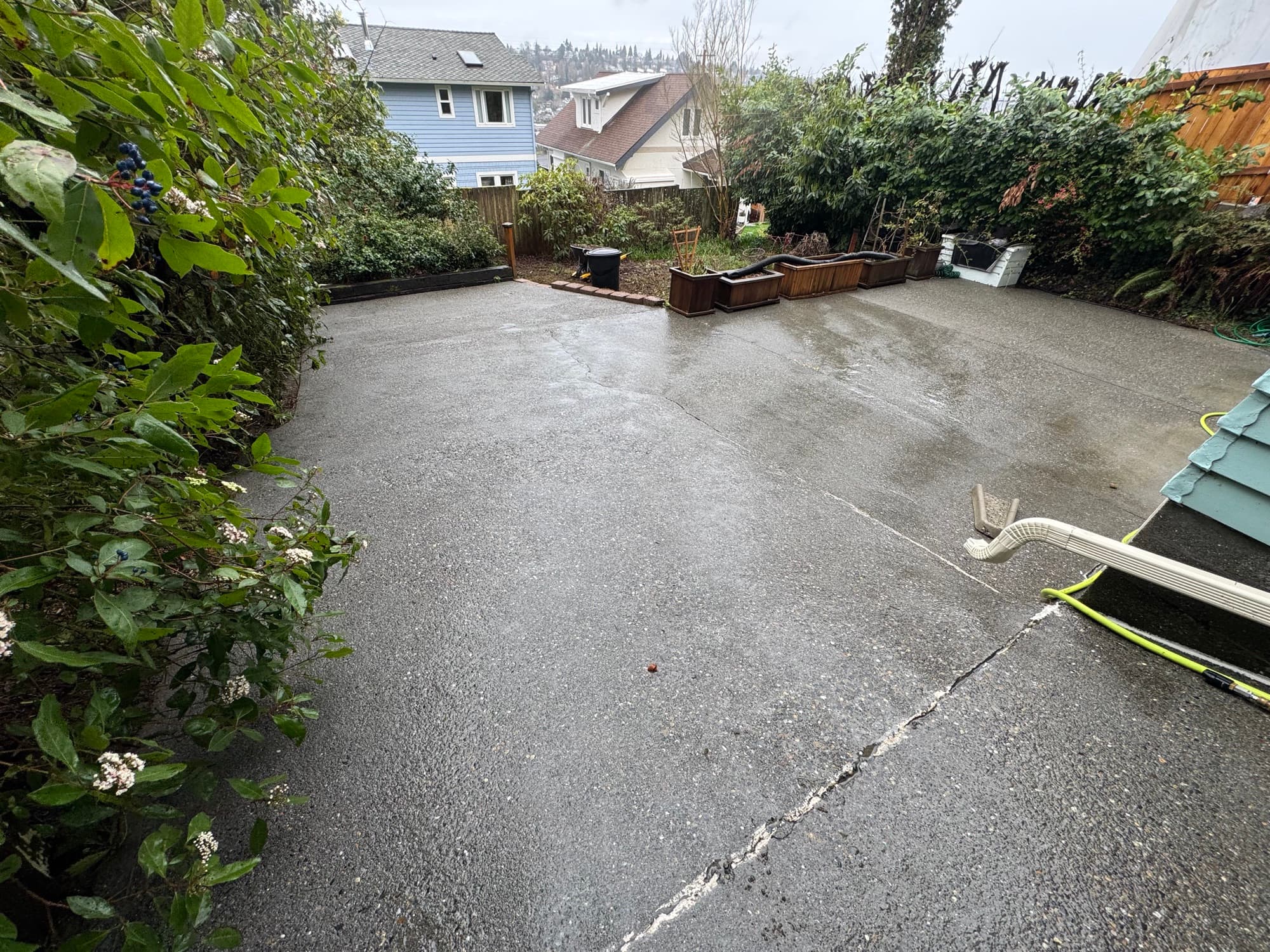 Seattle Suds surface cleaning a driveway, grime lifting in one pass